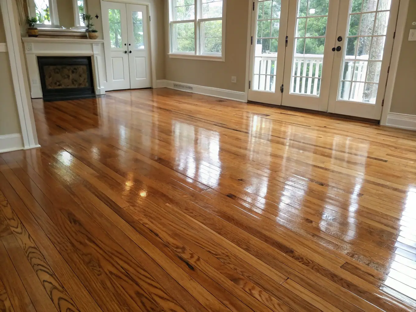 A close-up shot of a beautifully refinished hardwood floor with a rich, glossy finish, showcasing the intricate wood grain and the reflection of natural light. The image emphasizes the enhanced aesthetic appeal and quality of professional refinishing.